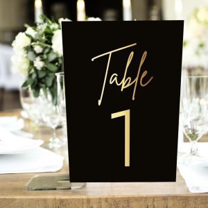 black and gold table numbers